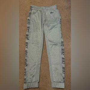 Nike XS Joggers with adjustable drawstring and zipper by ankles